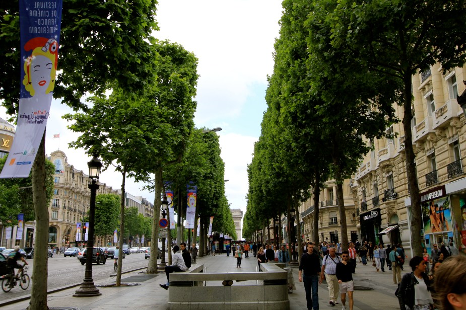 Strolling down the Champs Elysees from the Arc de Triomphe to the Louvre Museum 