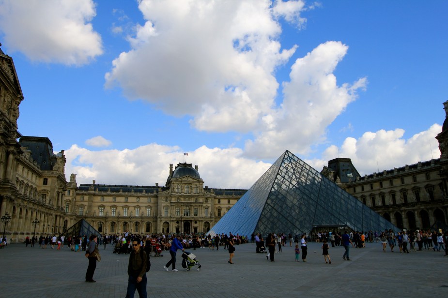 A beautiful day for a walk outside of the Louvre Museum