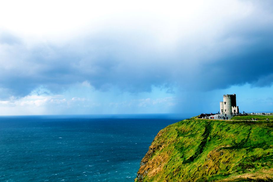 The colors were pretty cool....the greenish blue Atlantic Ocean against the lush, green cliffs with grey vertical stones against a light blue sky with puffy white clouds.