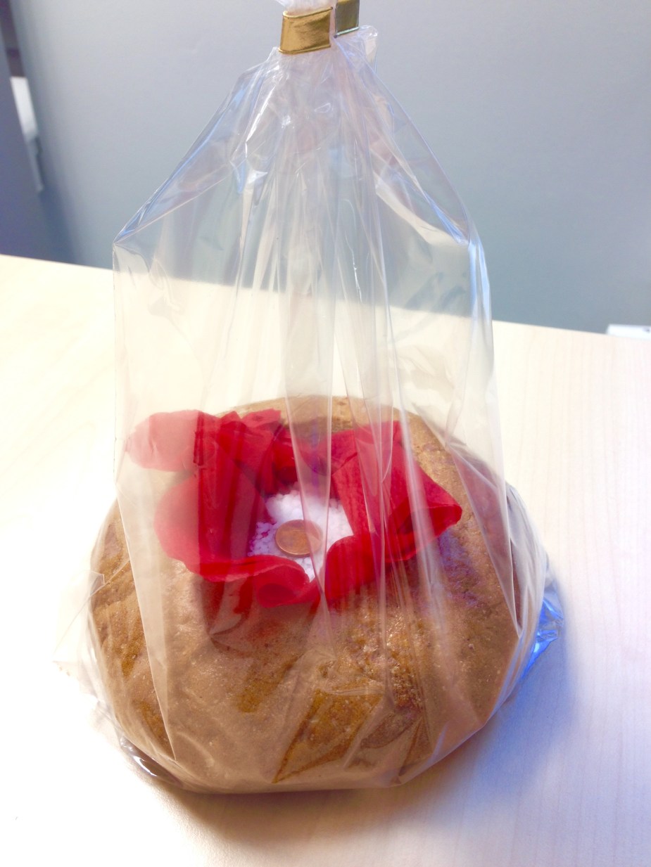 German traditional housewarming gift: bread, salt, & a coin (here the bread is used as a bowl to hold the salt & coin)