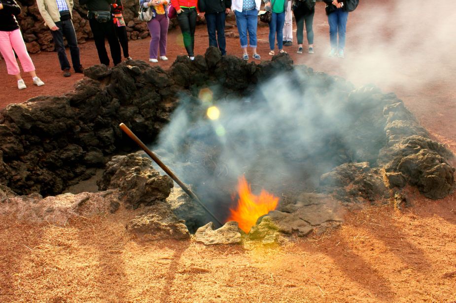Digging a little deeper, the temperatures quickly rise. Here the demonstration is placing straw into a pit that is about 2 feet deep. As soon as the straw is placed down there, it catches on fire. Also, to demonstrate the heat, there is a pipe that is dug into the ground where water was poured down it, and 3 seconds later a geyser of steam erupted 20 feet into the air. I do not have a picture of this, but do have the video which I will post later.