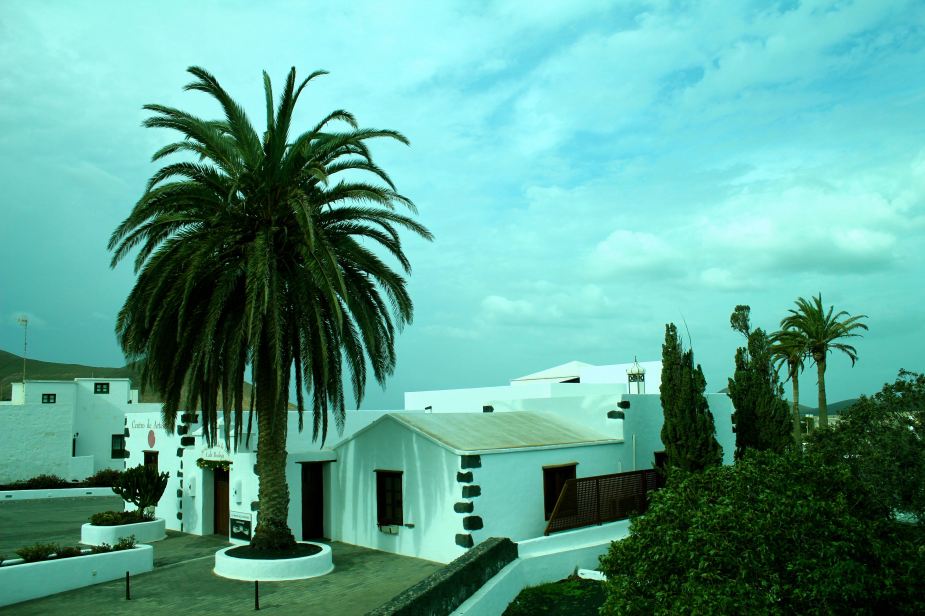 After leaving the small port capital city of Arrecife, we started to venture across the entire island. The island is covered in black volcanic soil and rocks with very little vegetation. So, the houses made from white-washed stone really stick out from the landscape.
