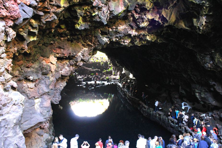After leaving the Mirador del Rio overlook, we then went to the northeast part of the island to very unique place. It is an actual lava tube (tunnel) created as the lava flowed from the volcanoes to the sea. This area is called the Jameos del Aqua.   So, we enter down into the opening of the lava tube and there is this small, clear lake within the tunnel