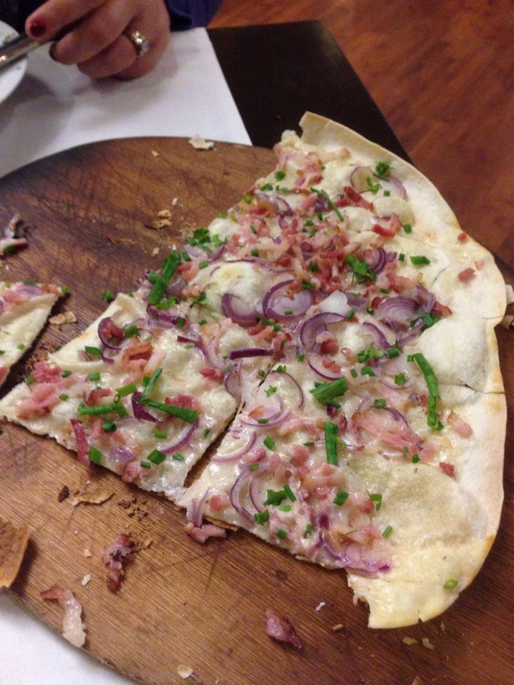 While pizza is not typically a fast food, there are places that will serve by the slice. If in the southwestern part of Germany like we are, a must try is Flammkuchen, which is a type of pizza with almost a cracker-type crust and instead of a tomato sauce has a cream-cheese type sauce....yeah, it's good