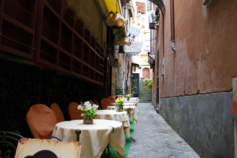 Walking the streets of Sorrento.  I love getting lost in small alleyways off the tourist paths....and, I find charming setups like this outdoor cafe waiting for the mid-day crowd.